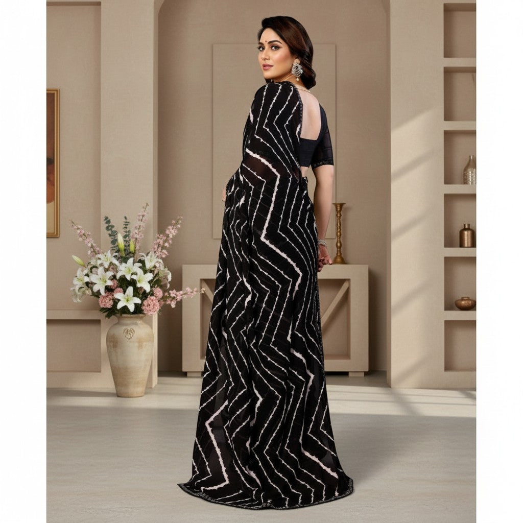 Shafusion black georgette saree with white geometric print and unstitched blouse worn by a model in a studio.