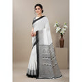 Shafusion black and white printed georgette saree with unstitched blouse worn by a woman in a studio setting