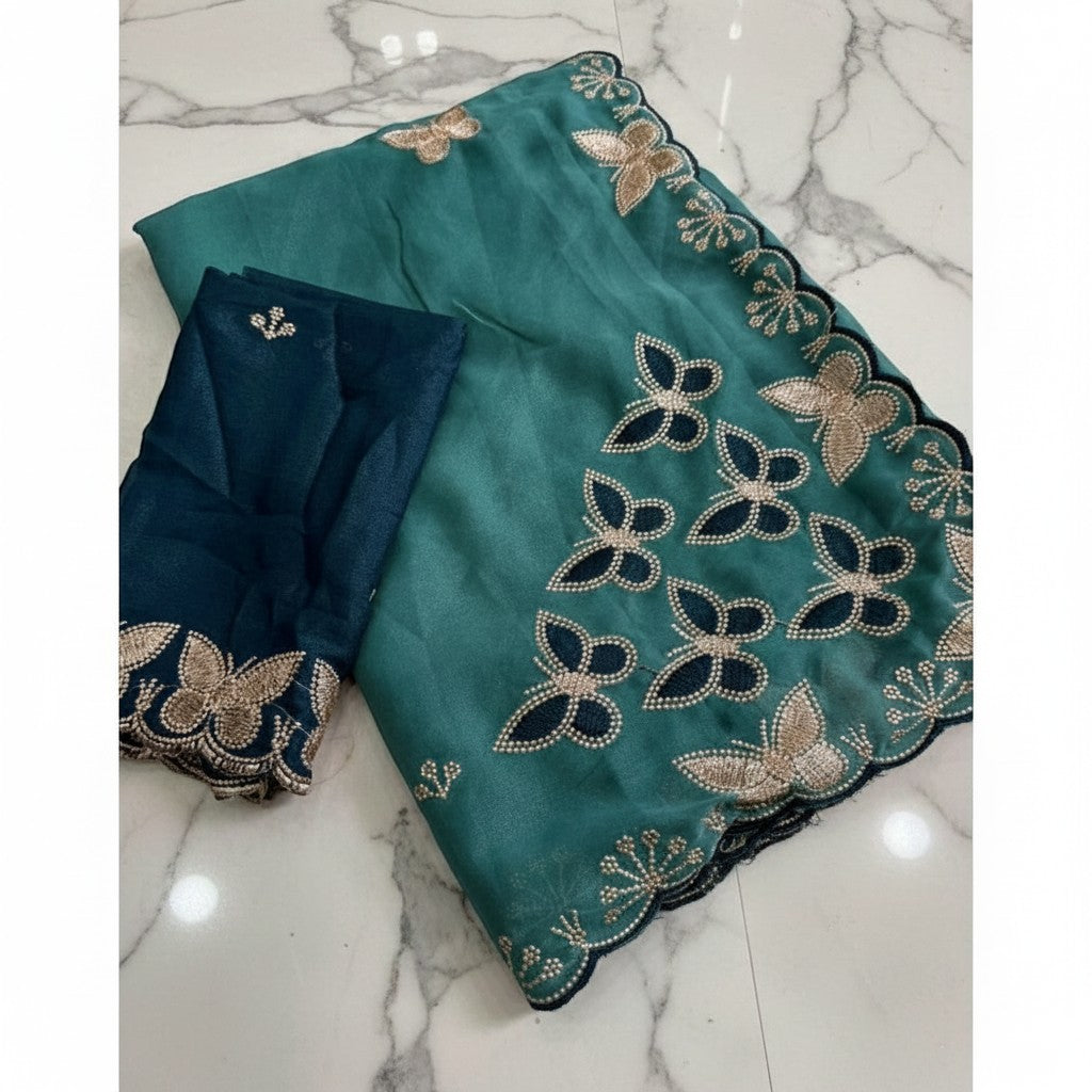 Shafusion blue star georgette saree featuring intricate butterfly embroidery and a matching unstitched blouse piece.