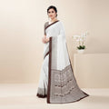 Shafusion coffee and white georgette printed saree with unstitched blouse worn by a model in a studio setting