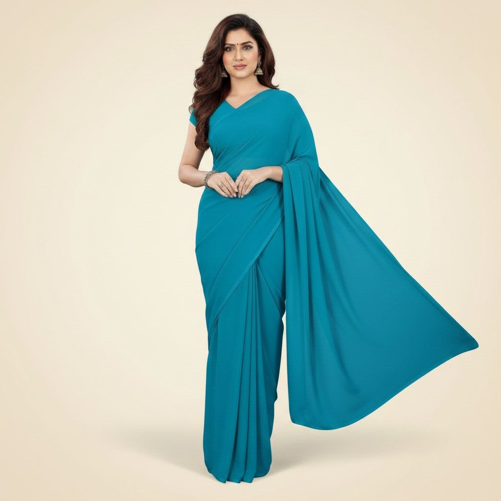 Shafusion dark firozi georgette plain saree with matching blouse worn by a woman for casual and festive occasions