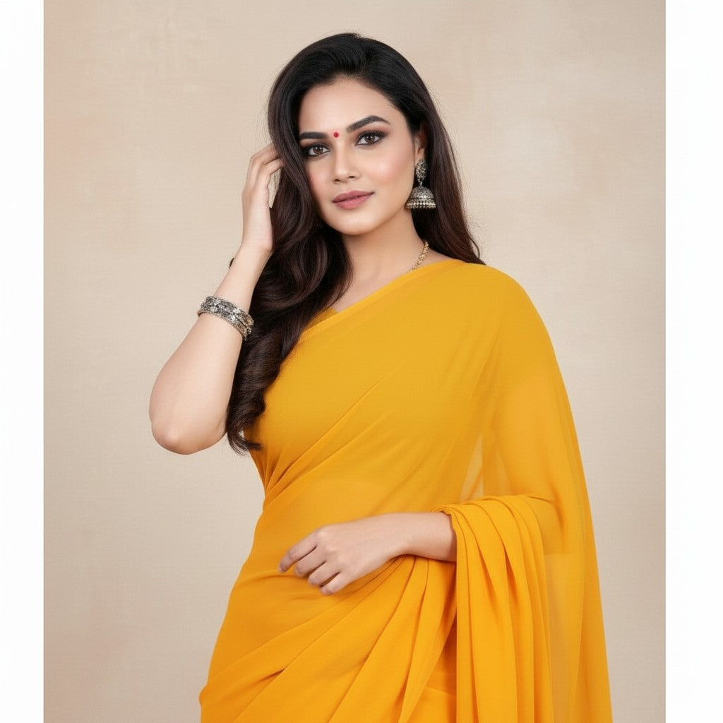 Shafusion gold georgette plain saree worn by a woman with traditional jewelry for festive and casual occasions