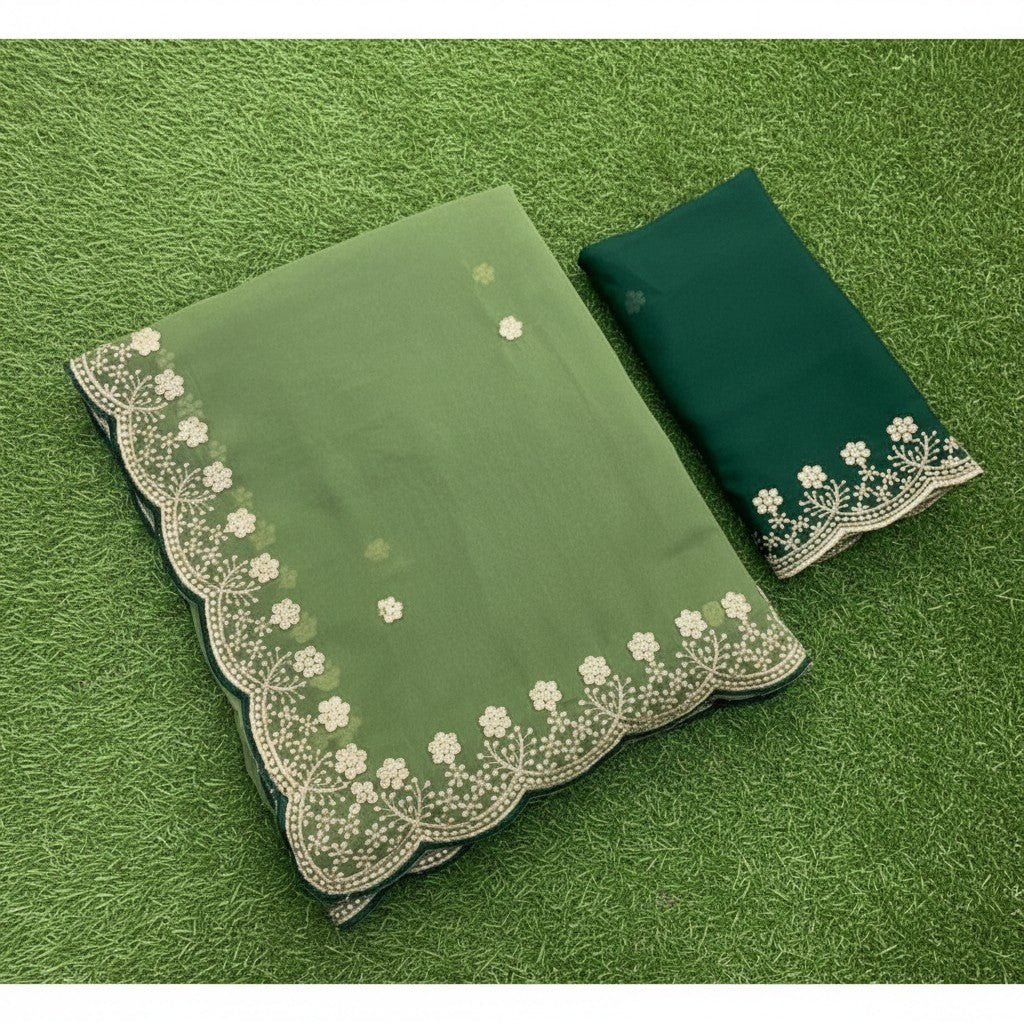 Shafusion green star georgette saree featuring intricate embroidery and an unstitched matching blouse piece.