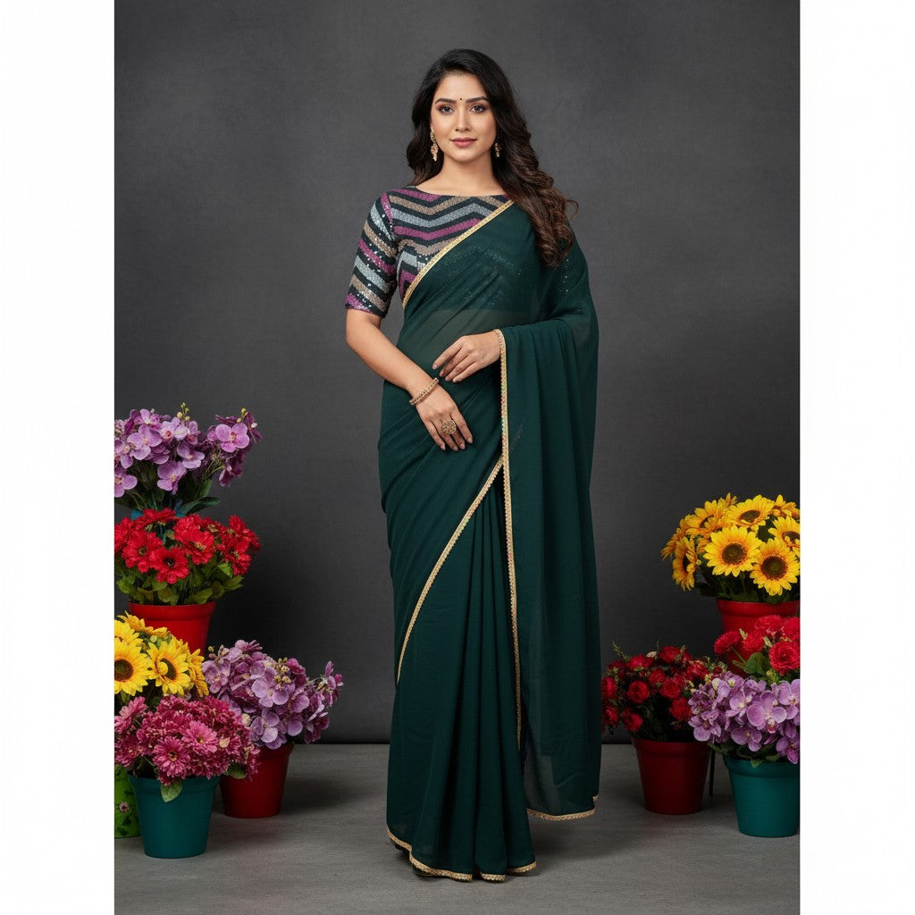Shafusion green fox georgette solid saree with gold border and patterned blouse worn by a model among flower pots