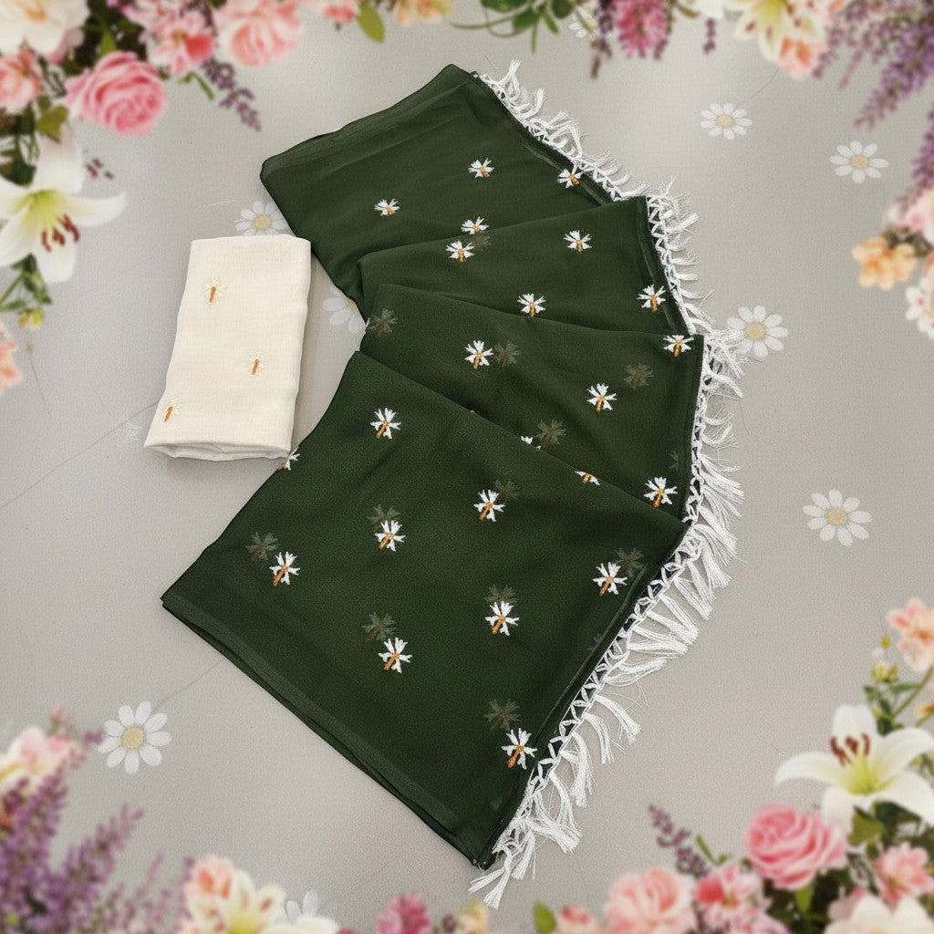 Shafusion green georgette saree with white floral embellishments and fringe trim, including an unstitched blouse piece.