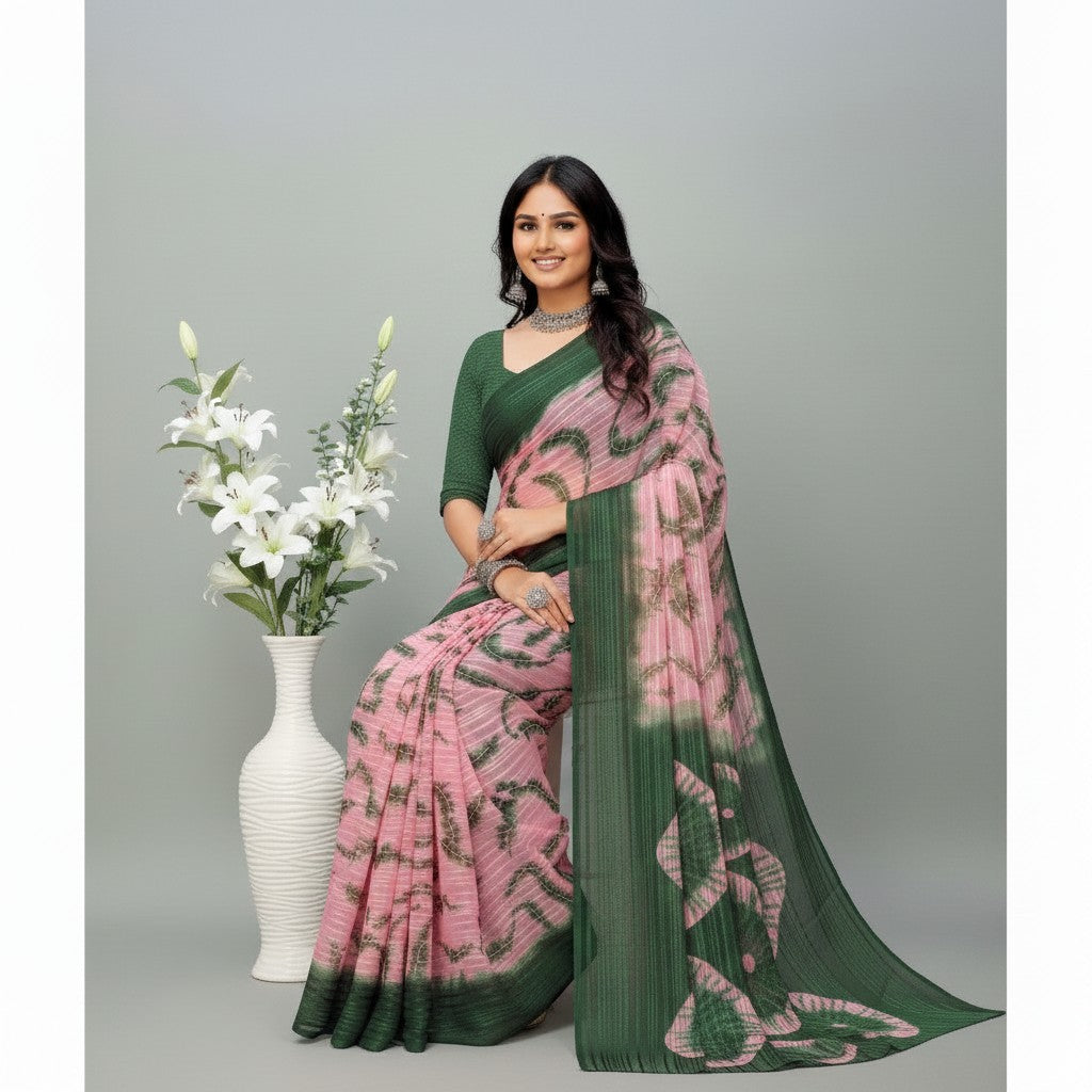 Shafusion green and pink printed georgette saree with unstitched blouse worn by a woman next to a white lily vase
