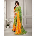 Shafusion green and yellow georgette printed saree with unstitched blouse worn by a model in a studio setting.