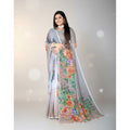 Shafusion grey georgette saree with vibrant floral print and matching unstitched blouse worn by a smiling model