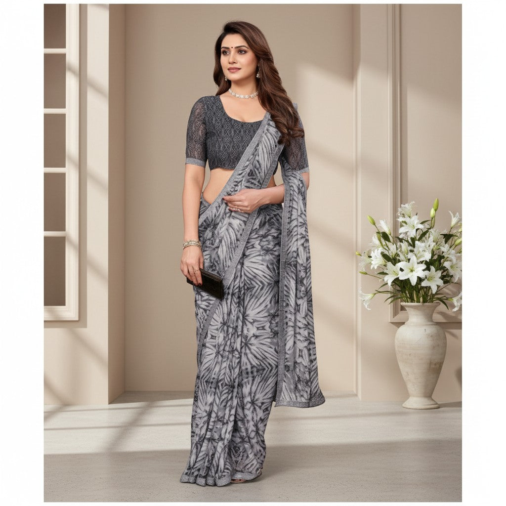 Shafusion grey georgette printed saree with a matching dark grey unstitched blouse worn by a model in a studio.