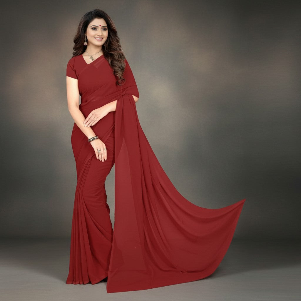 Shafusion maroon georgette plain saree worn by a woman with a matching blouse for festive and casual wear