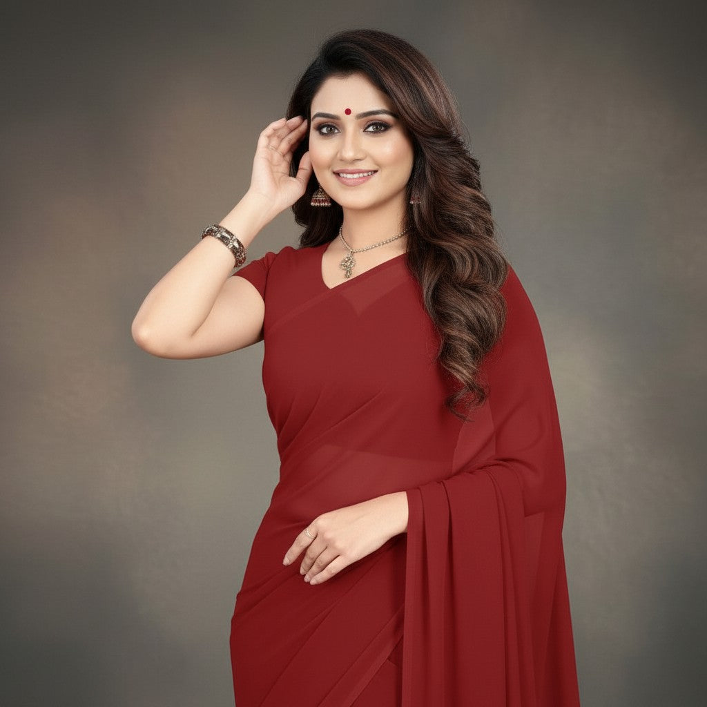 Shafusion maroon georgette plain saree worn by a smiling woman with elegant jewelry for festive or casual wear