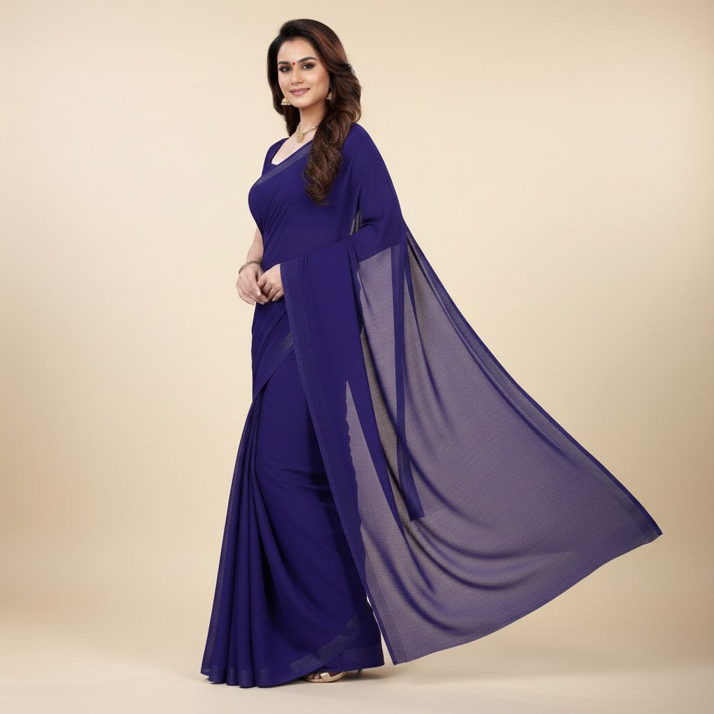 Shafusion navy blue plain georgette saree worn by a woman, featuring a flowing pallu for casual and festive wear.