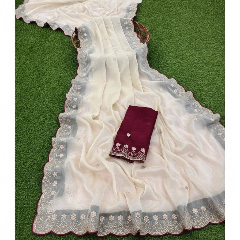 Shafusion off white star georgette saree with intricate floral embroidery and a contrasting maroon unstitched blouse.