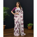 Shafusion pink and white floral printed georgette saree worn by a woman with a matching purple unstitched blouse