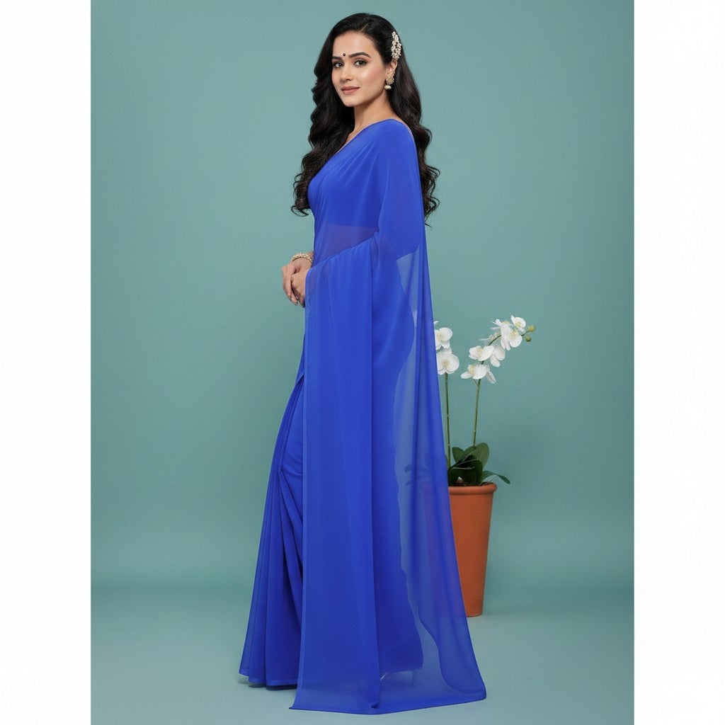 Shafusion royal blue georgette saree worn by a model, featuring a plain design for casual and festive occasions.