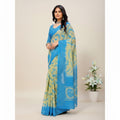 Shafusion skyblue and yellow georgette printed saree with unstitched blouse worn by a woman