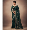 Shafusion teal georgette saree with intricate gold embroidery and matching unstitched blouse on a model