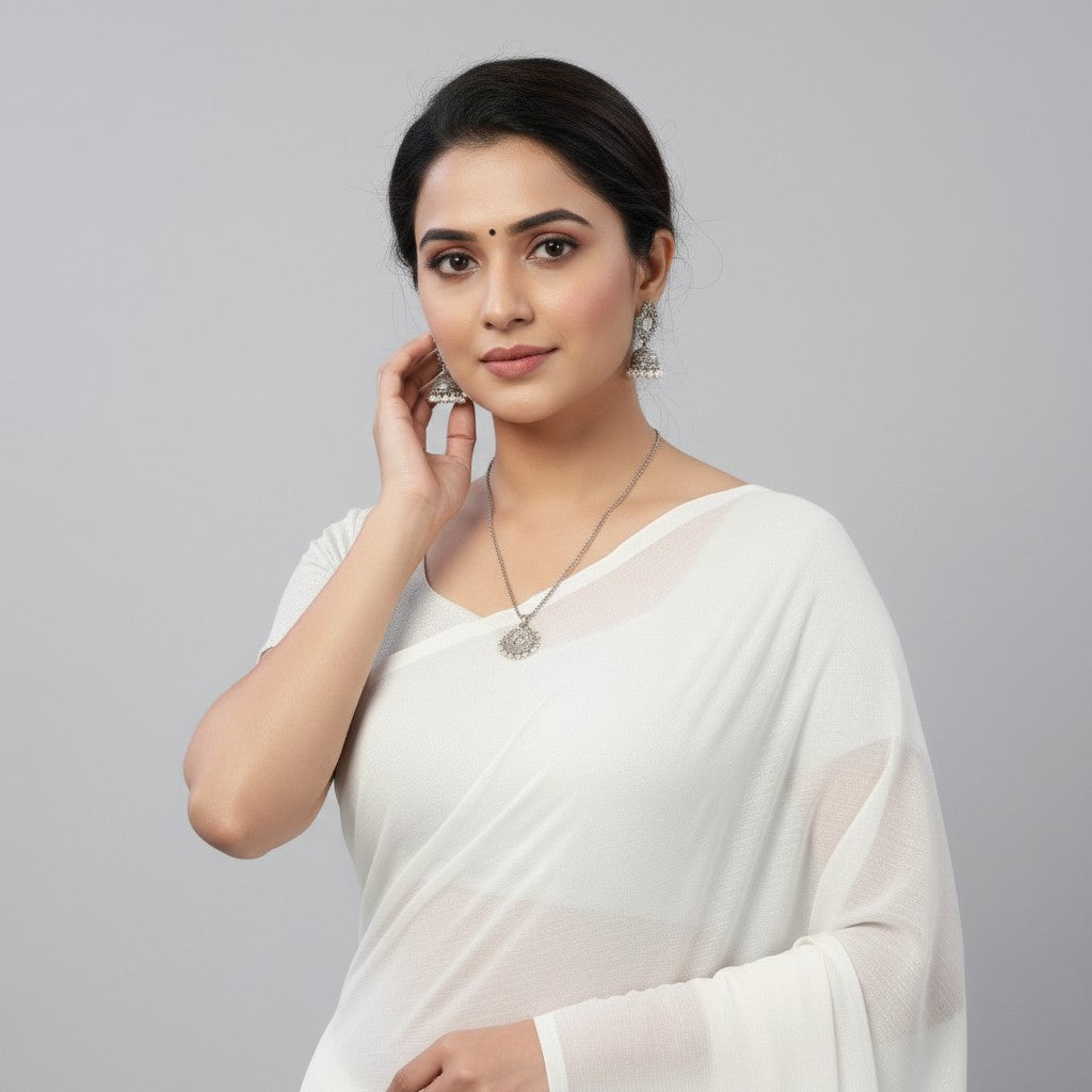 Shafusion white georgette plain saree worn by a woman with silver jewelry against a neutral background